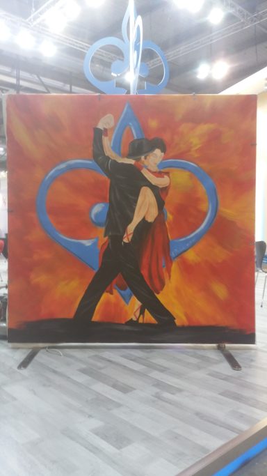Messeauftritt Livebemalung: 
2x2m Leinwand
Tango Argentino Paar mit dem Firmenlogo im Hintergrund